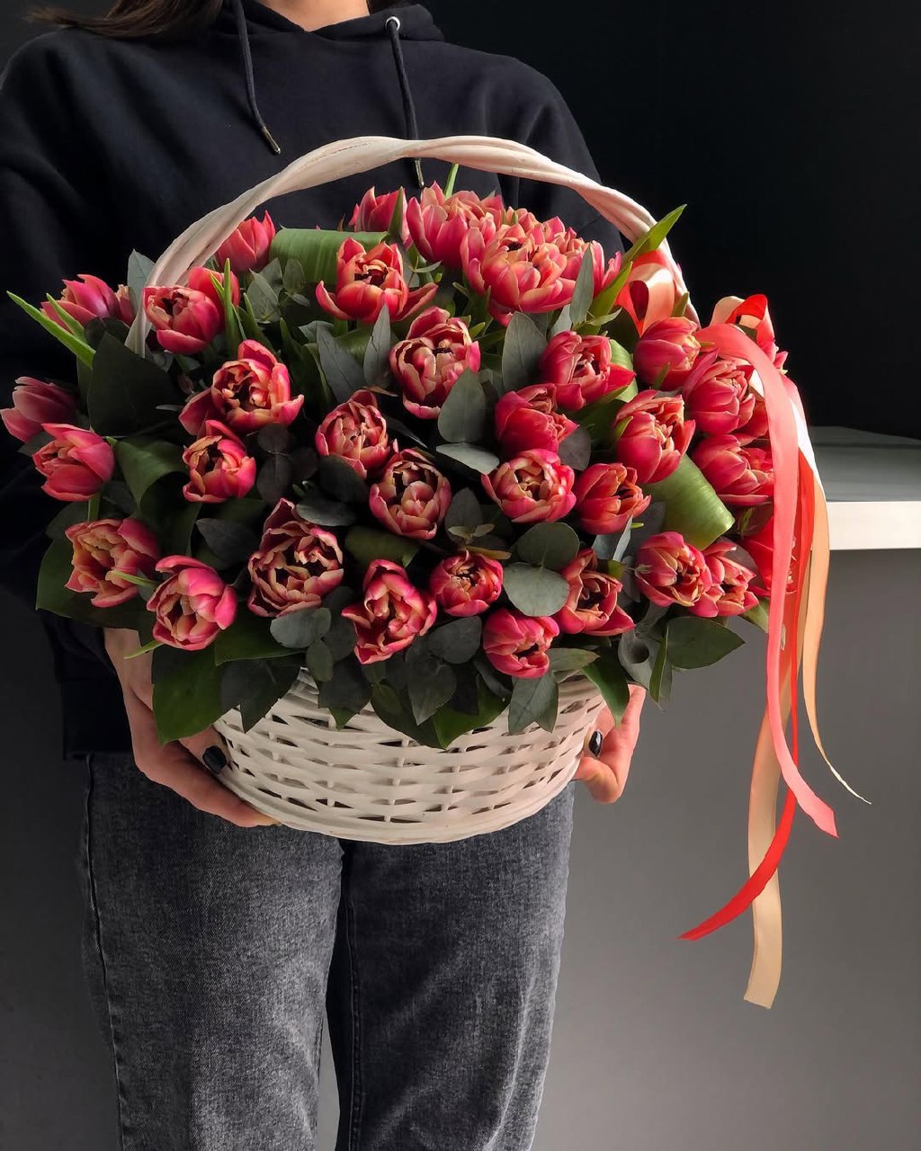 a basket of red tulips
